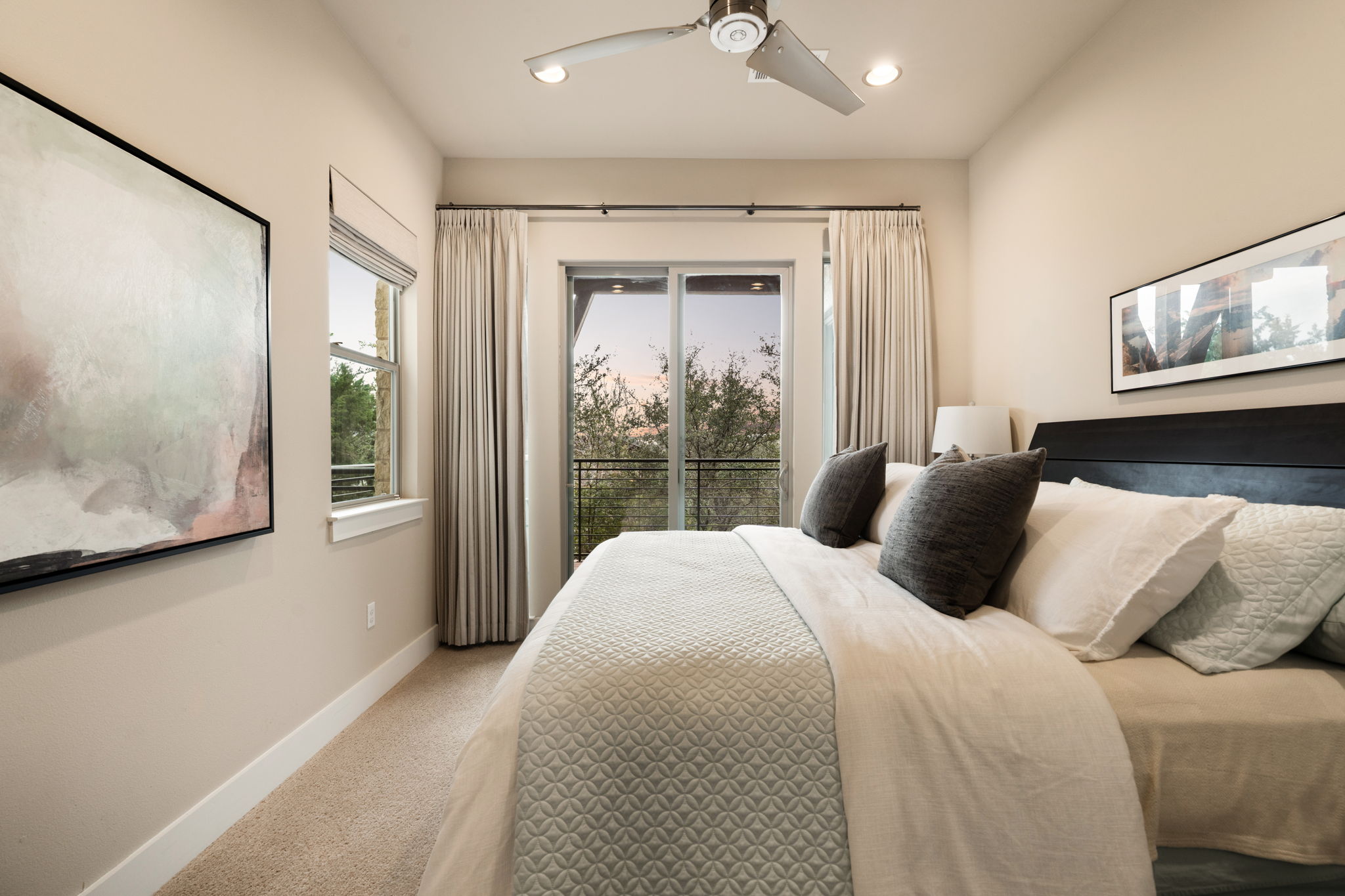 8110 Ranch Road 2222, Unit 81 Austin, TX 78730 - Photo 18 of 28 a bedroom with a large bed and a large window