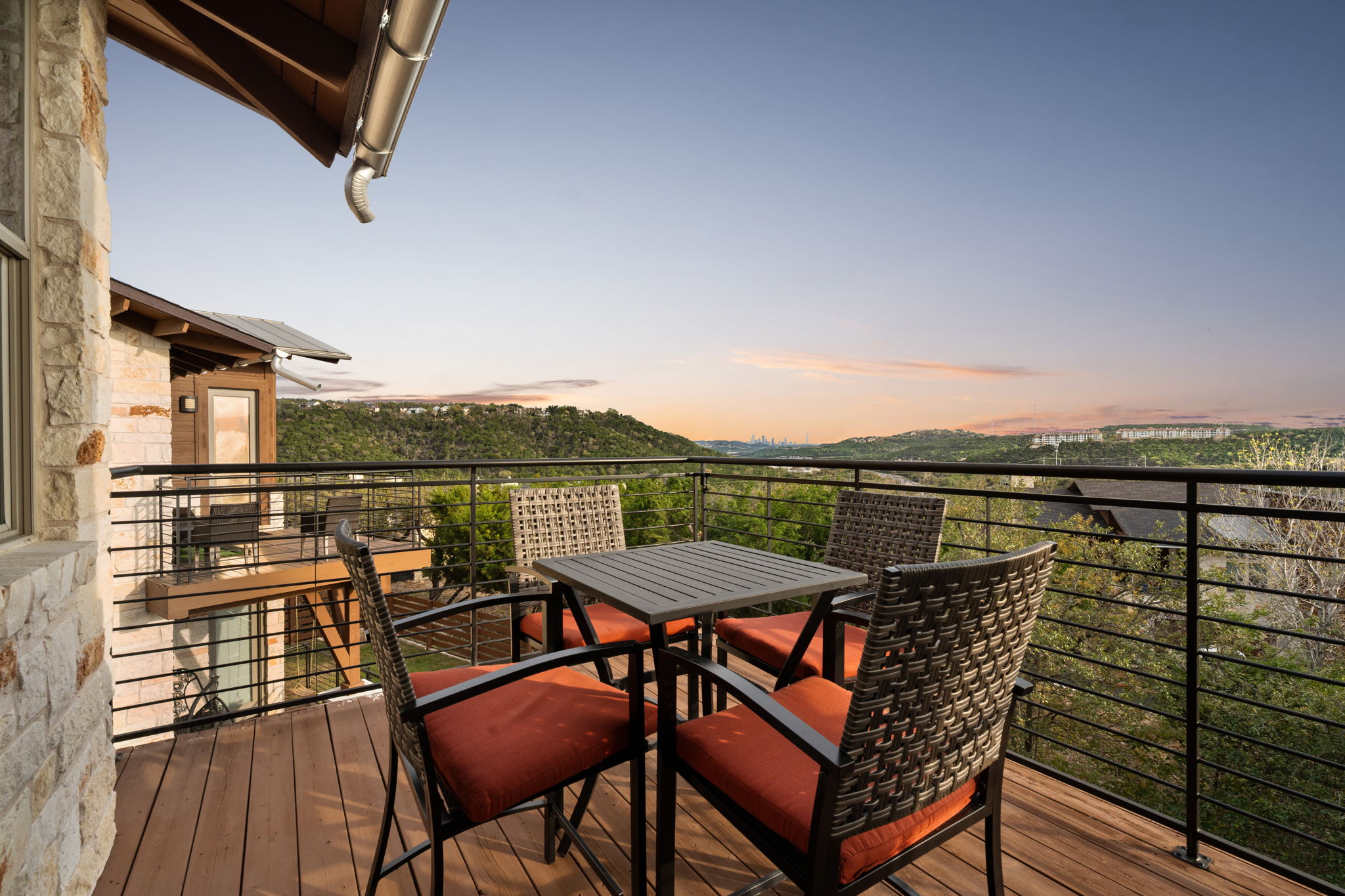 8110 Ranch Road 2222, Unit 81 Austin, TX 78730 - Photo 21 of 28 a view of a balcony with table and chairs