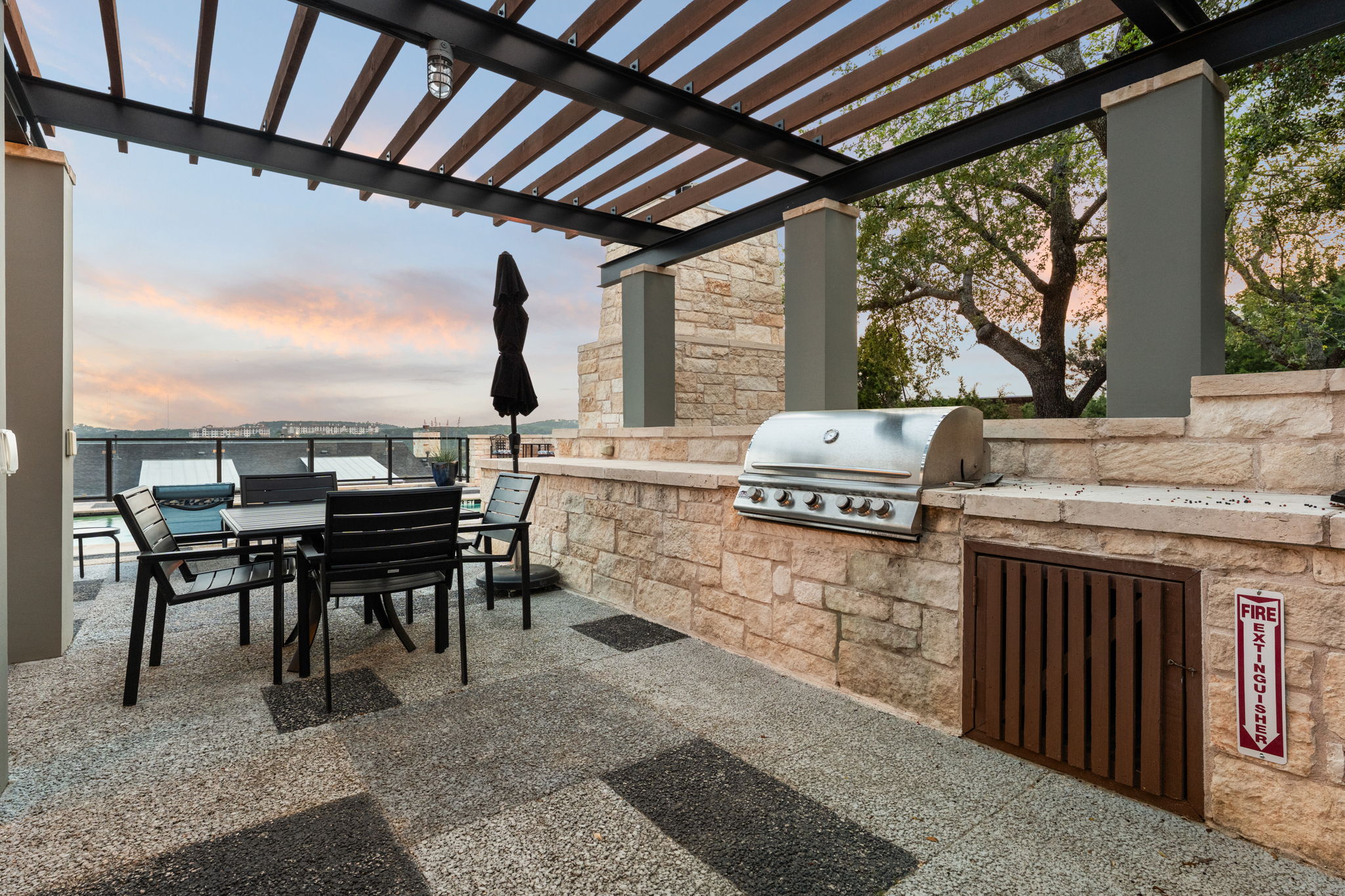 8110 Ranch Road 2222, Unit 81 Austin, TX 78730 - Photo 28 of 28 a dining room with furniture and a floor to ceiling window