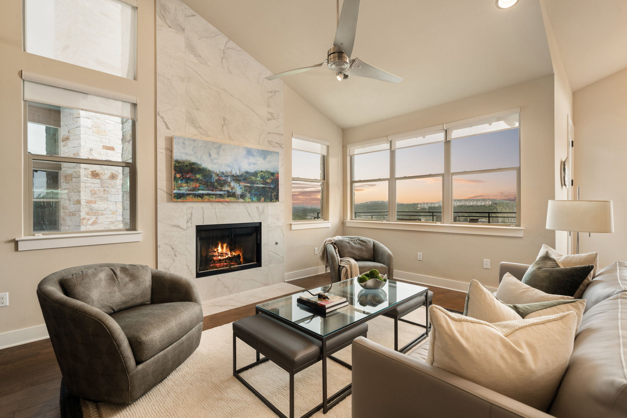 8110 Ranch Road 2222, Unit 81 Austin, TX 78730 - Photo 4 of 28 a living room with furniture a fireplace a large window and a flat screen tv