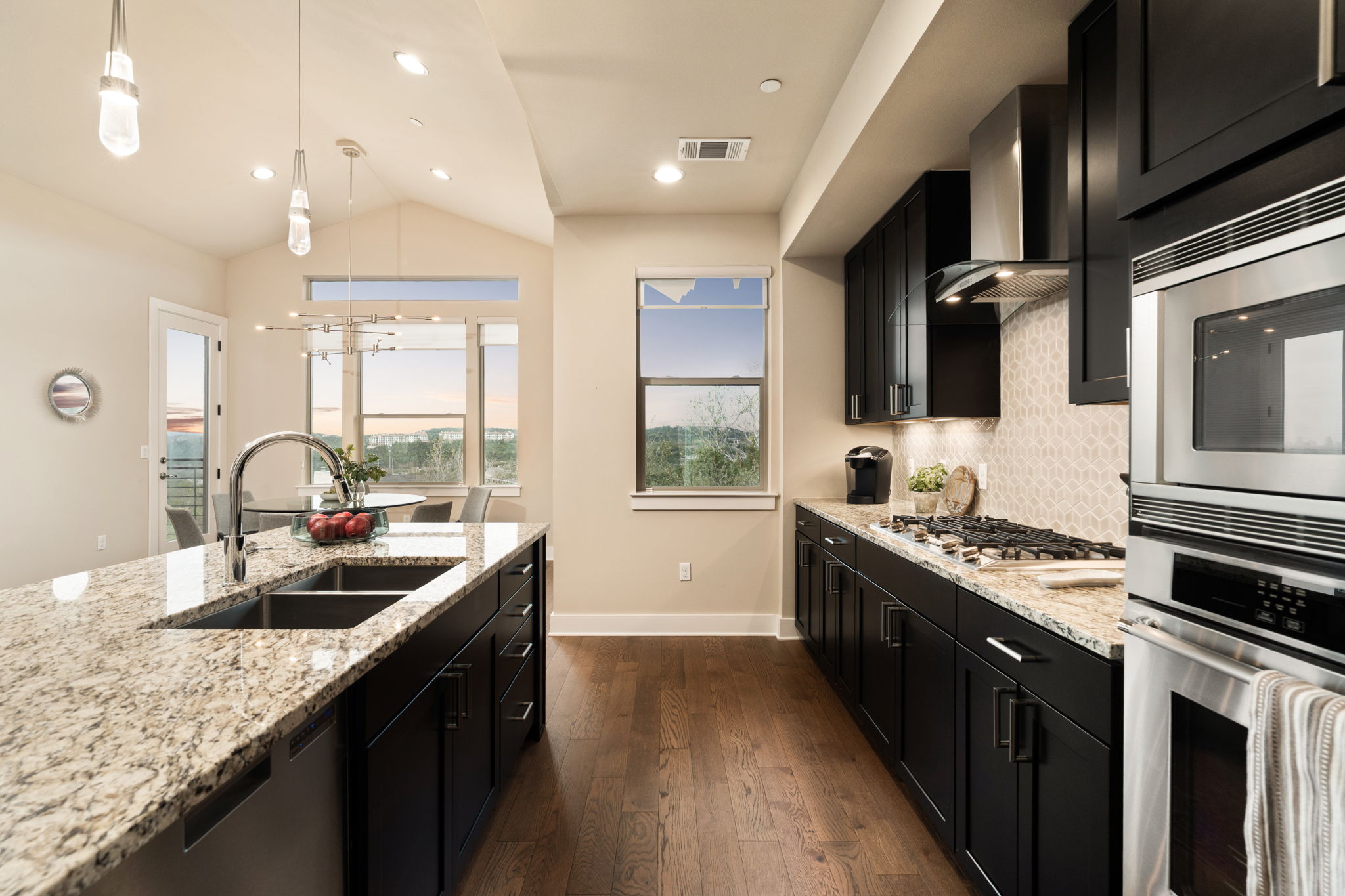 8110 Ranch Road 2222, Unit 81 Austin, TX 78730 - Photo 10 of 28 a kitchen with granite countertop a sink and stove