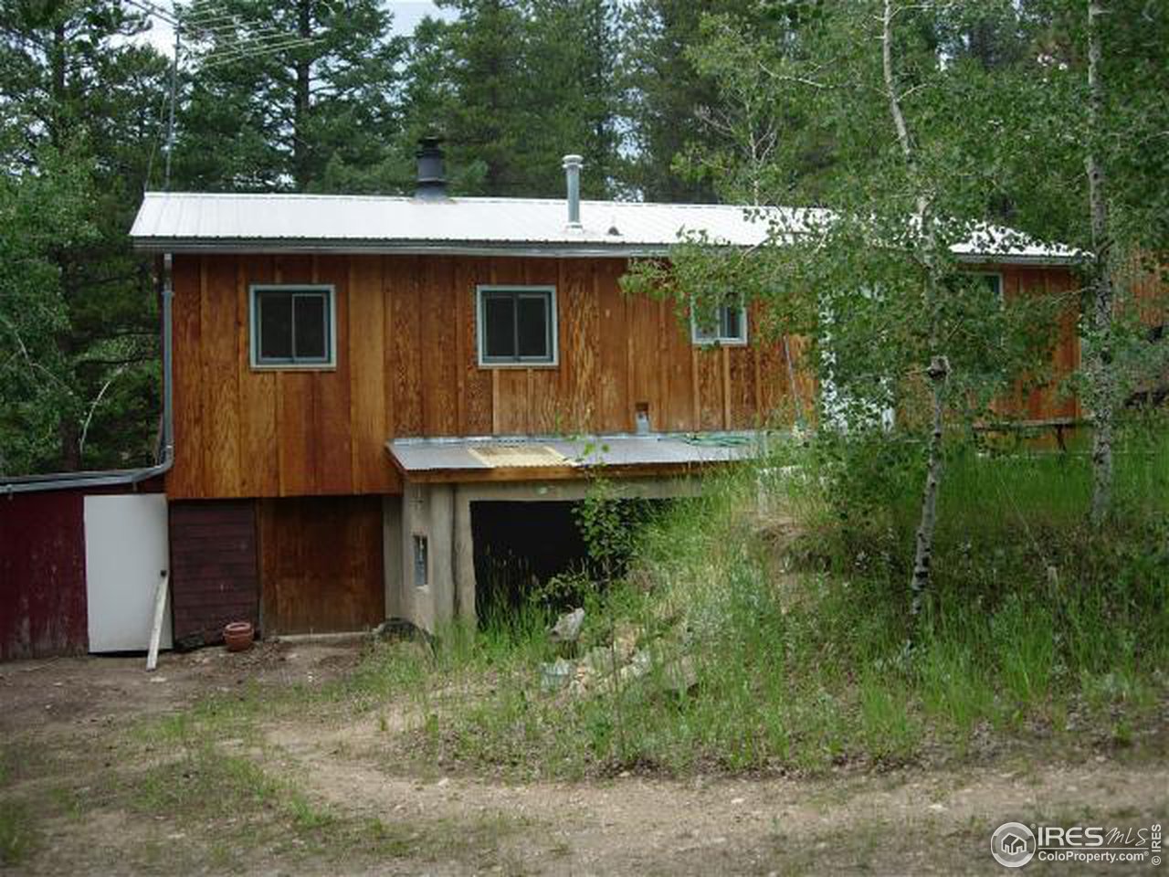 1654 Ridge Road Nederland, CO 80466 - Photo 3 of 18 a view of a house with a yard and plants