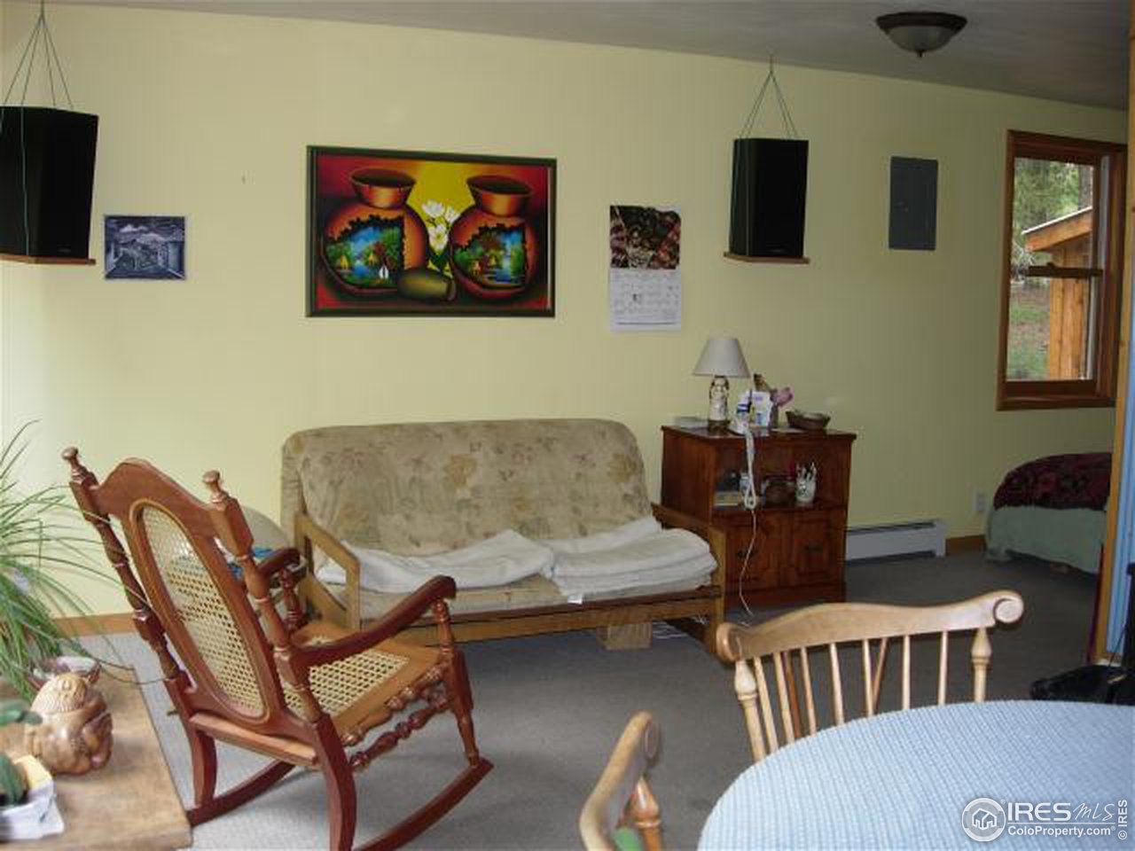 1654 Ridge Road Nederland, CO 80466 - Photo 7 of 18 a living room with patio furniture and a wooden floor