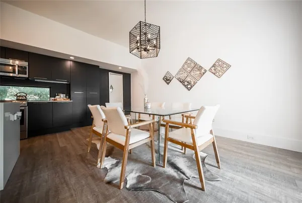 a workspace room with furniture and a wooden floor