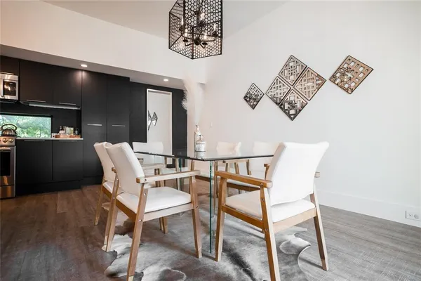 a view of a livingroom with furniture and wooden floor