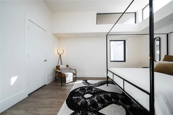a room with bed and window