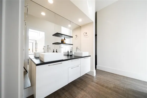 a kitchen with sink stove and cabinets