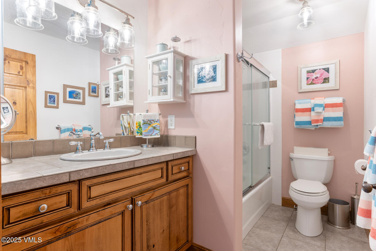 25 Sunset Court Eagle, CO 81631 - Photo 19 of 47 a bathroom with a granite countertop sink a toilet a mirror and shower