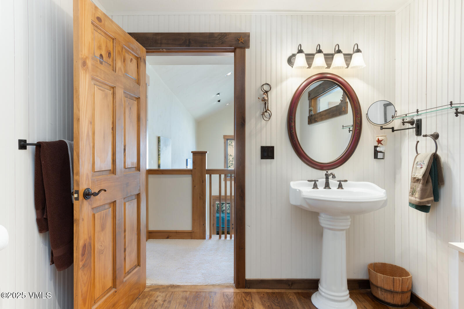 25 Sunset Court Eagle, CO 81631 - Photo 22 of 47 a bathroom with a sink a mirror and a window