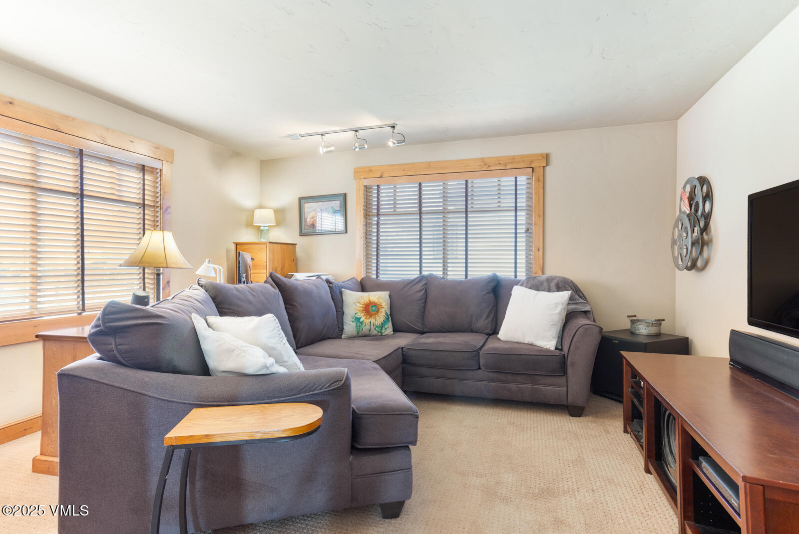 25 Sunset Court Eagle, CO 81631 - Photo 23 of 47 a living room with furniture and a flat screen tv