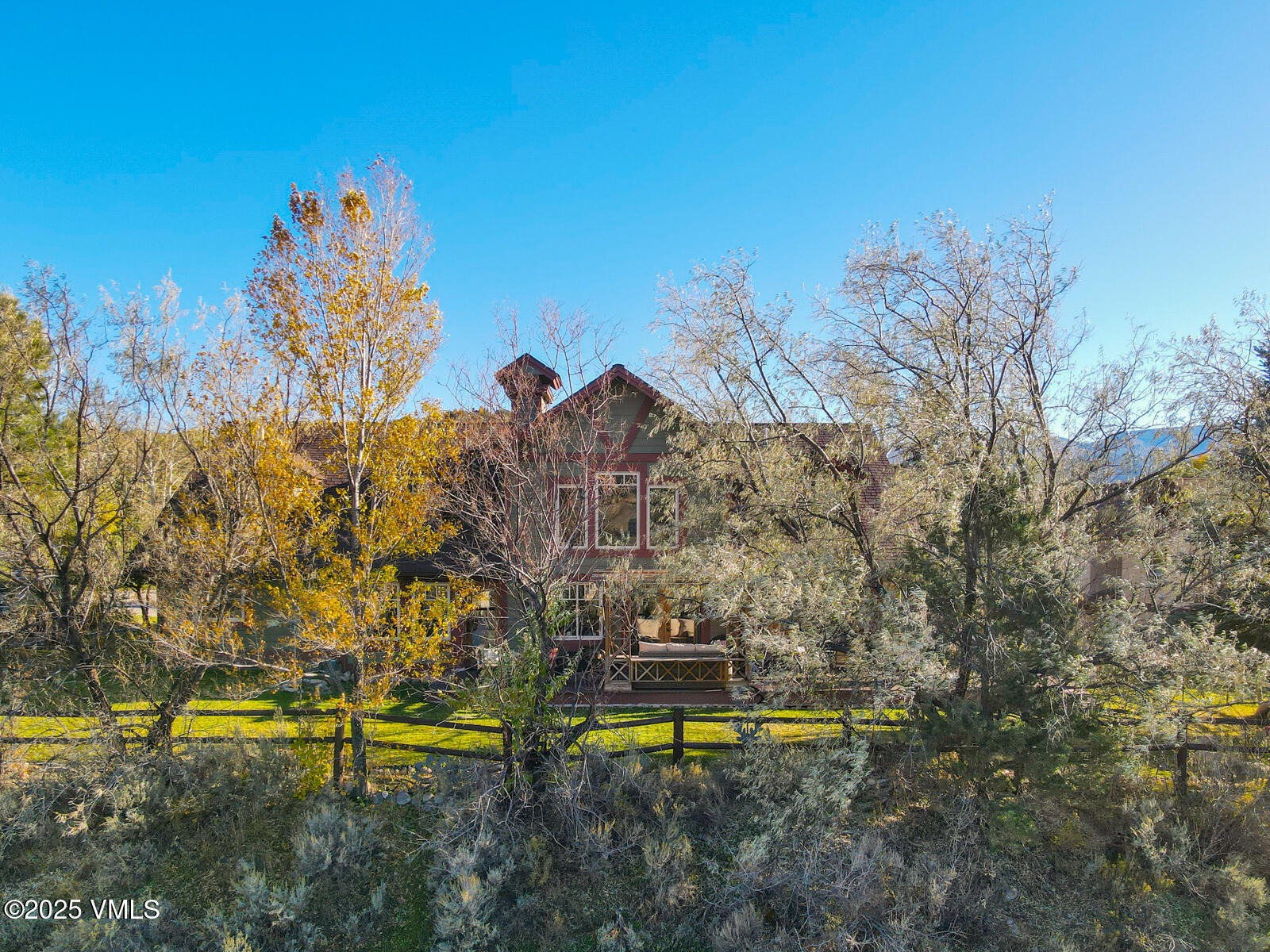 25 Sunset Court Eagle, CO 81631 - Photo 42 of 47 a view of a lake with a building in the background