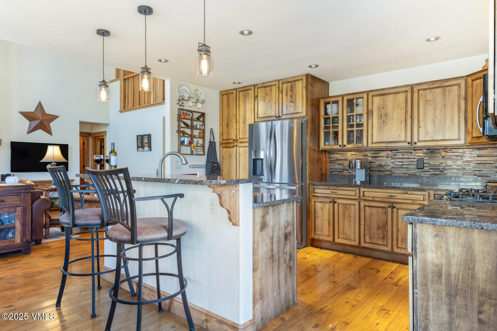 25 Sunset Court Eagle, CO 81631 - Photo 8 of 47 a view of kitchen with stainless steel appliances granite countertop dining table chairs cabinets and a sink