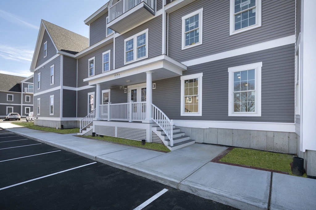 50 Country Way, Unit C204 Scituate, MA 02066 - Photo 18 of 22 a front view of a house with a yard