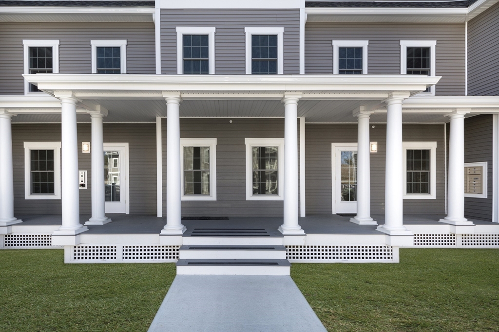 50 Country Way, Unit C204 Scituate, MA 02066 - Photo 21 of 22 front view of a house with a yard