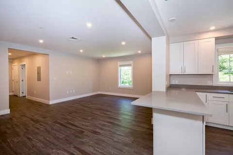 a view of a kitchen with a sink and a window