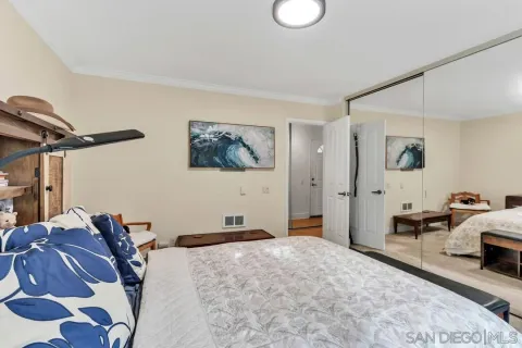 a bed room with a bed and a couch