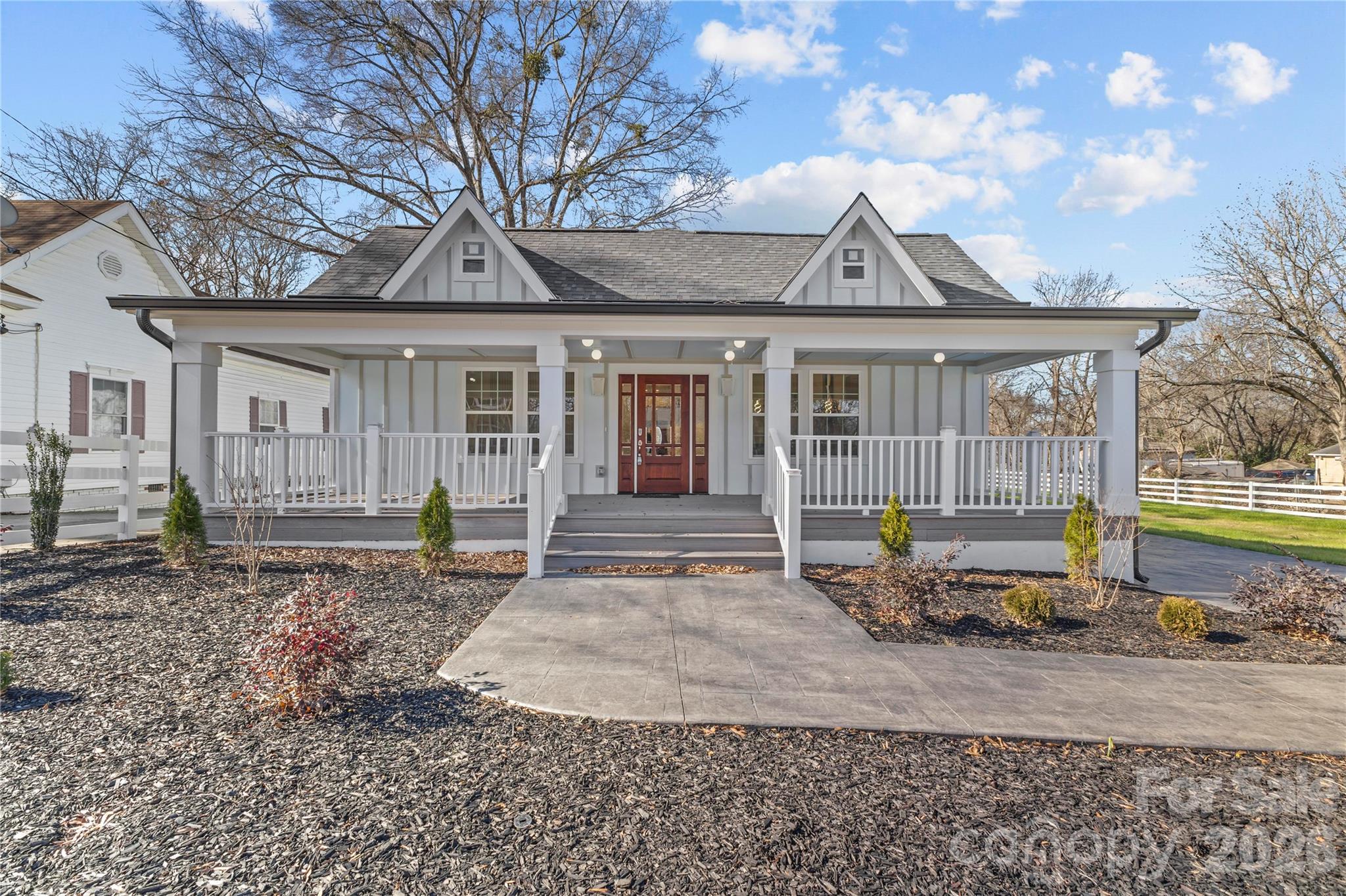 a front view of a house with garden
