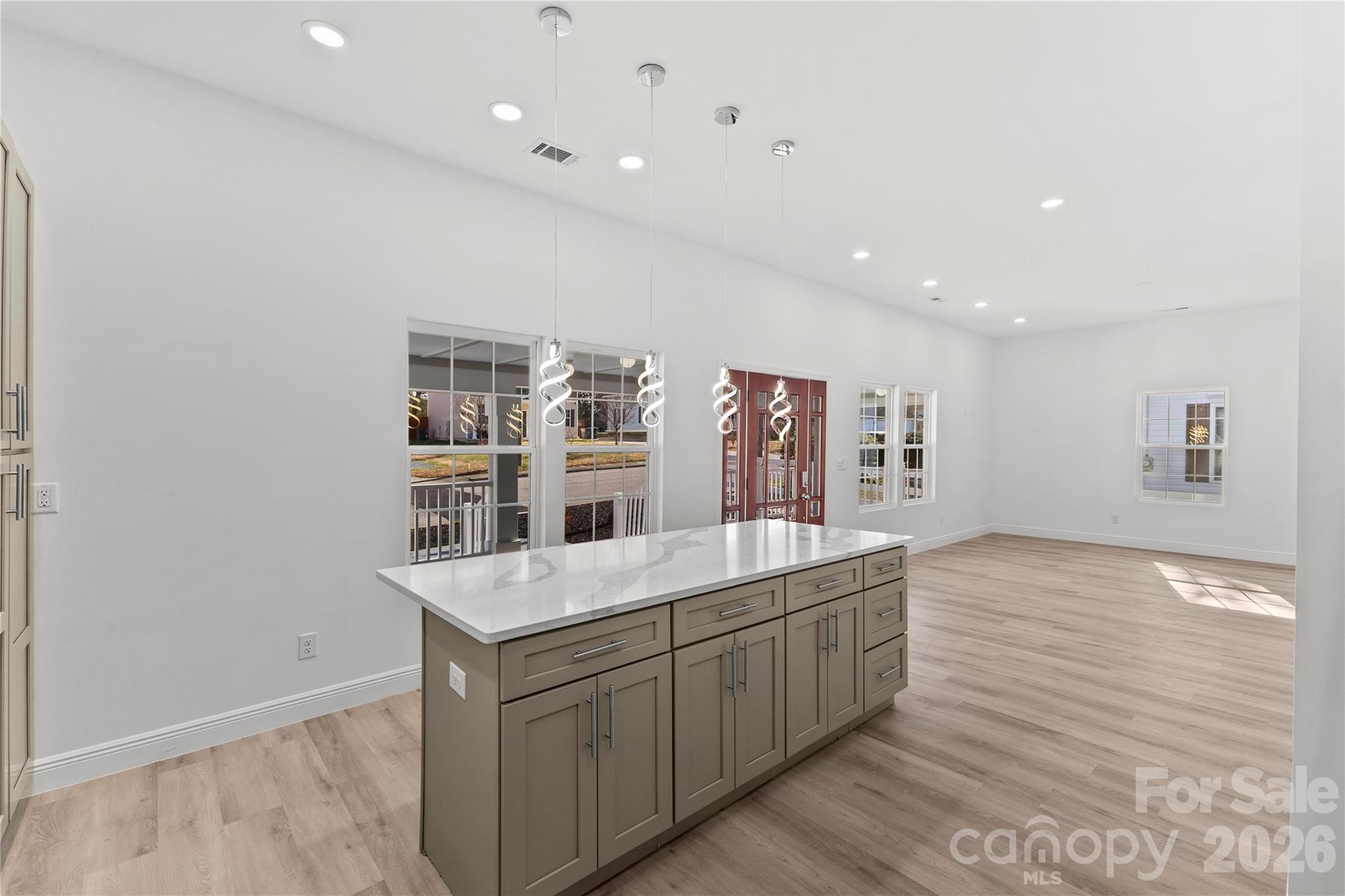 417 Boyte Street Monroe, NC 28110 - Photo 19 of 42 a room with a cabinets and wooden floor