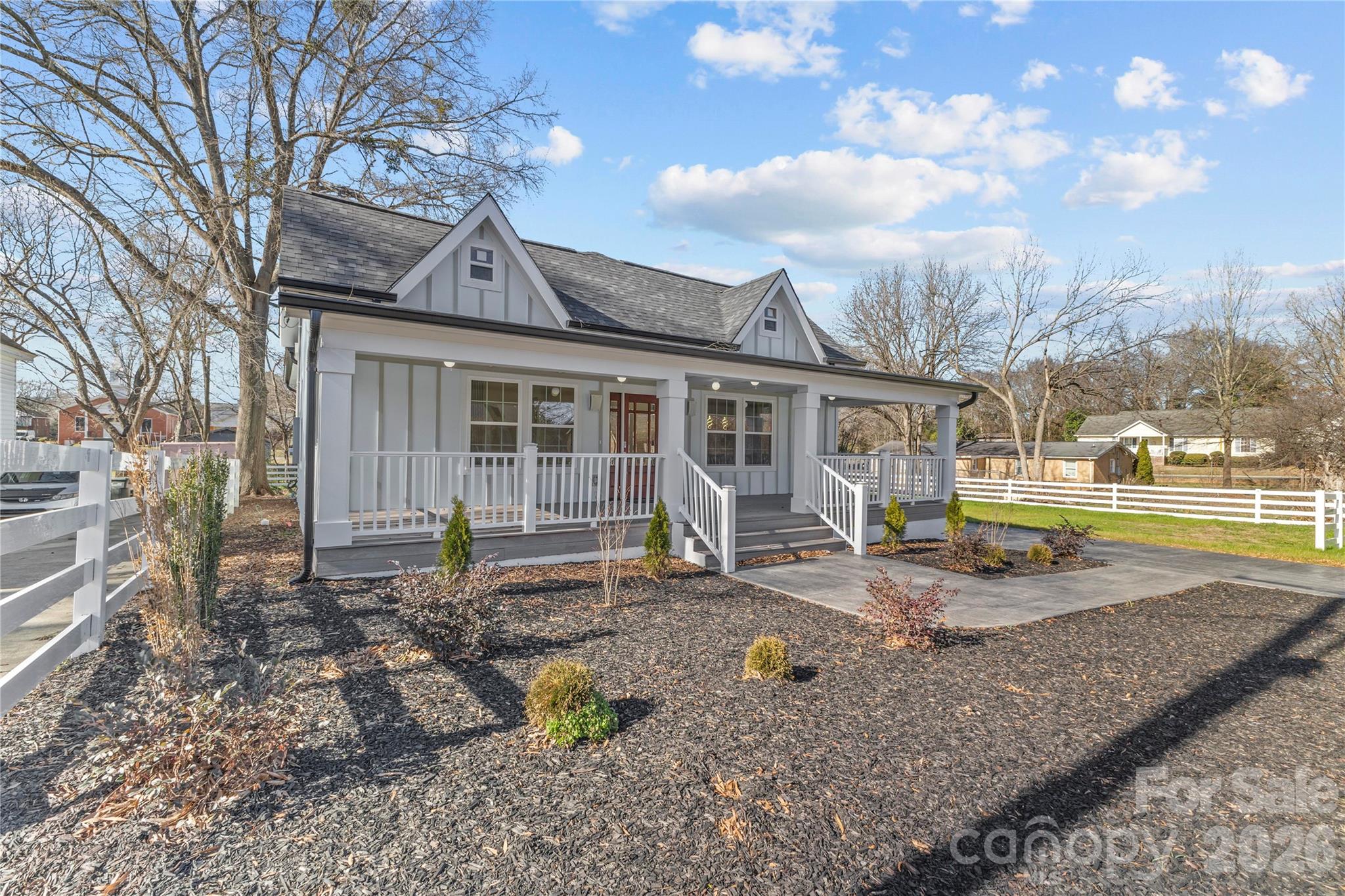 417 Boyte Street Monroe, NC 28110 - Photo 2 of 42 a backyard of a house with barbeque oven table and chairs