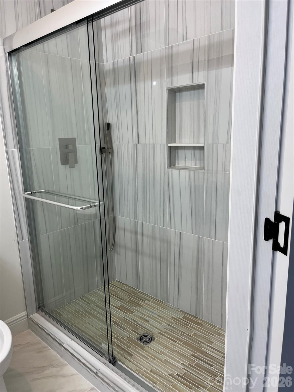 417 Boyte Street Monroe, NC 28110 - Photo 22 of 42 a bathroom with a shower and a glass door