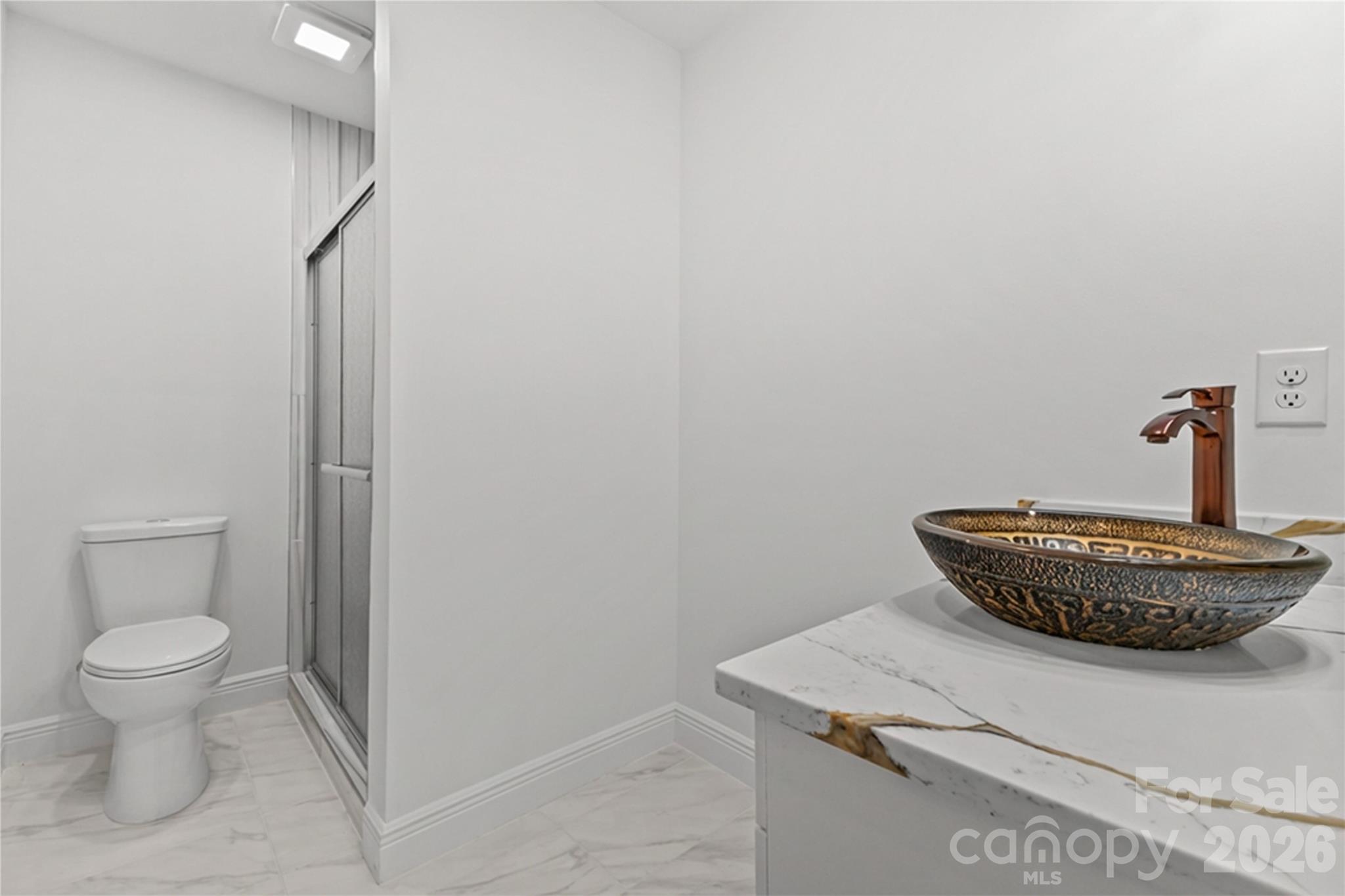 417 Boyte Street Monroe, NC 28110 - Photo 23 of 42 a bathroom with a sink toilet and a mirror