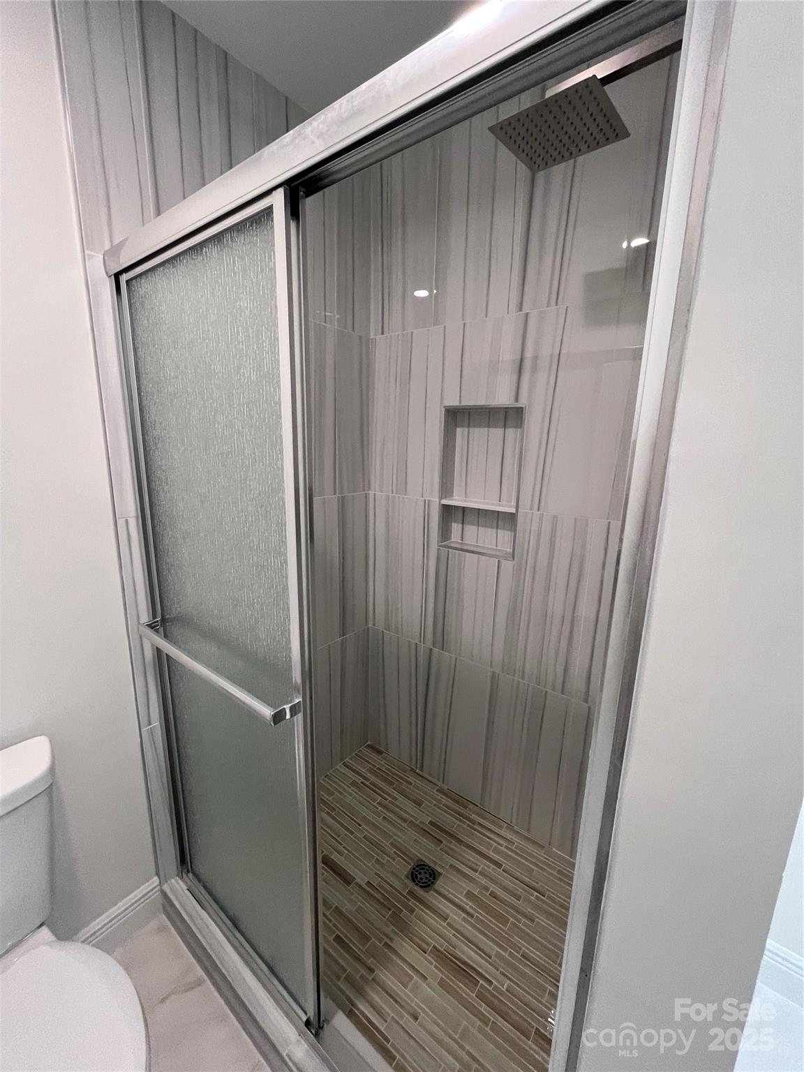 417 Boyte Street Monroe, NC 28110 - Photo 23 of 25 a bathroom with a glass door shower