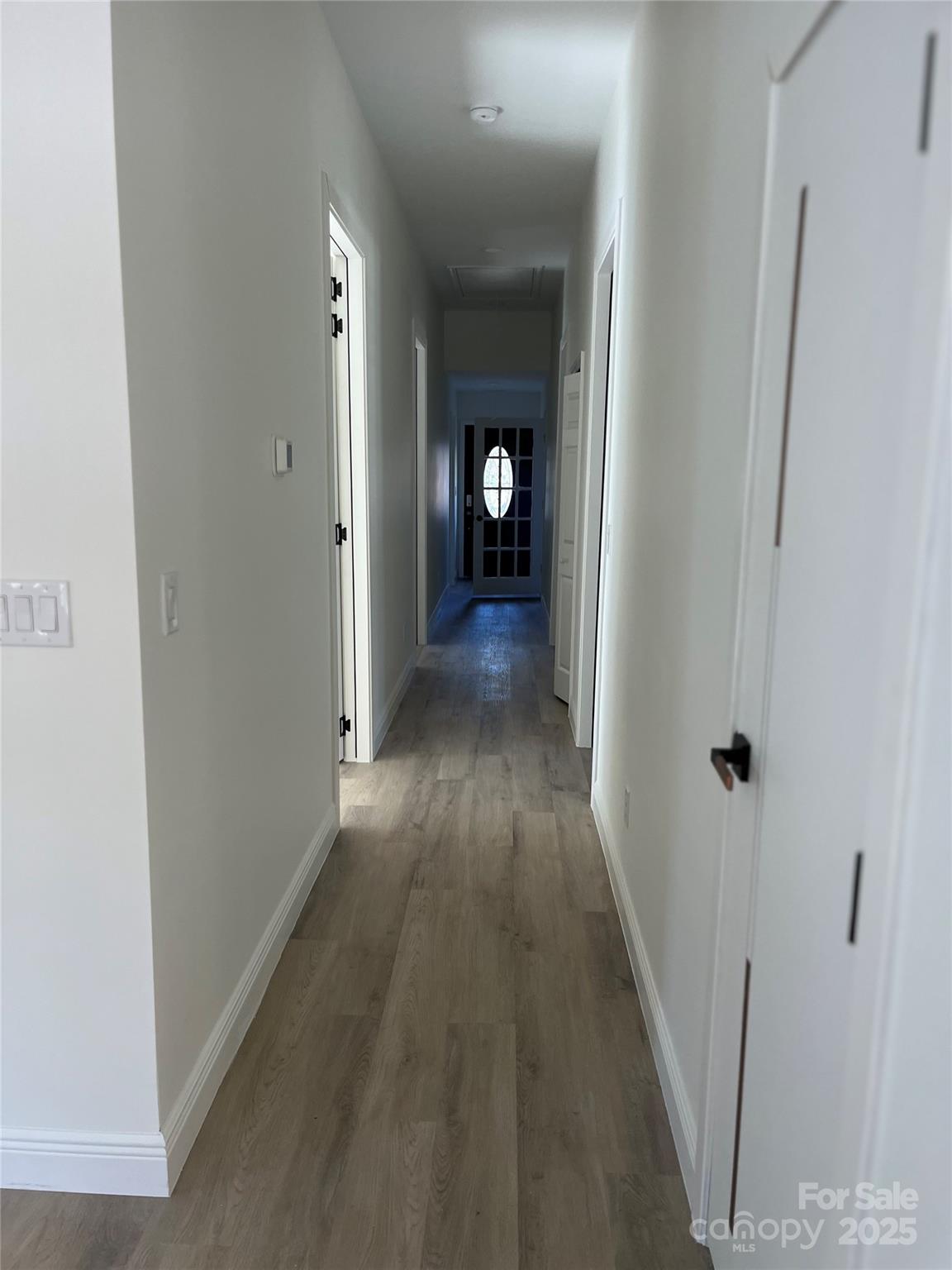 417 Boyte Street Monroe, NC 28110 - Photo 24 of 25 a view of a hallway with wooden floor