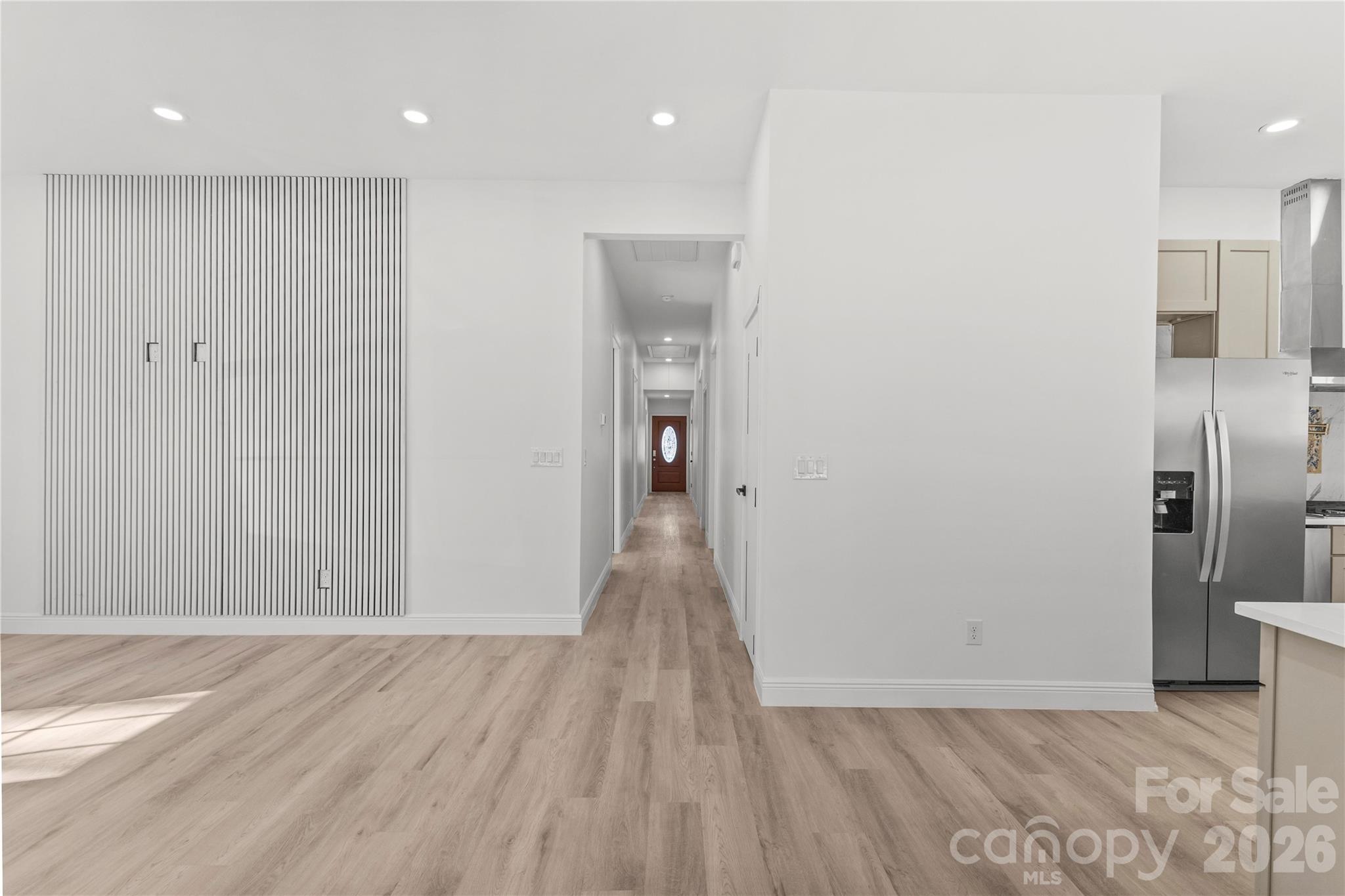 417 Boyte Street Monroe, NC 28110 - Photo 25 of 42 a view of a hallway with wooden floor and a bathroom
