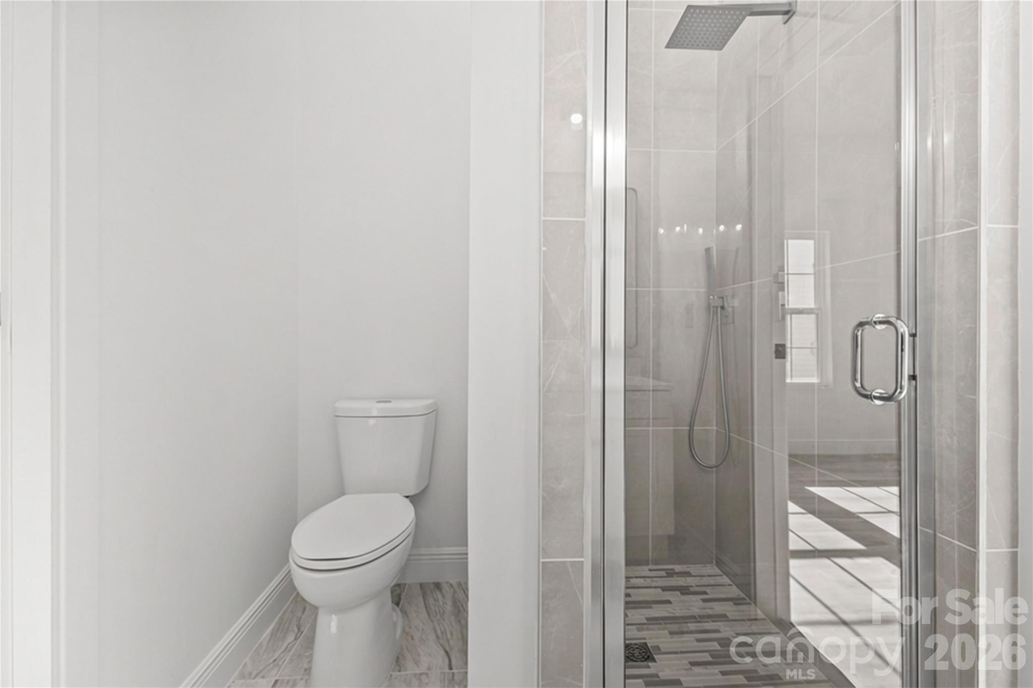 417 Boyte Street Monroe, NC 28110 - Photo 27 of 42 a bathroom with a toilet and shower