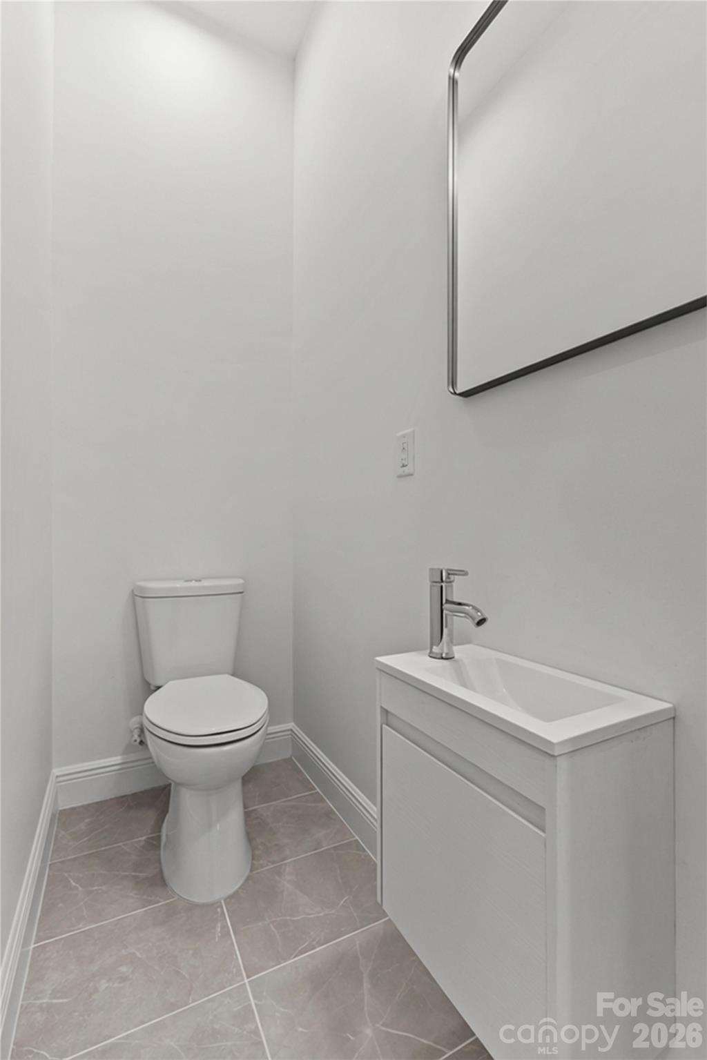 417 Boyte Street Monroe, NC 28110 - Photo 32 of 42 a bathroom with a sink mirror and toilet