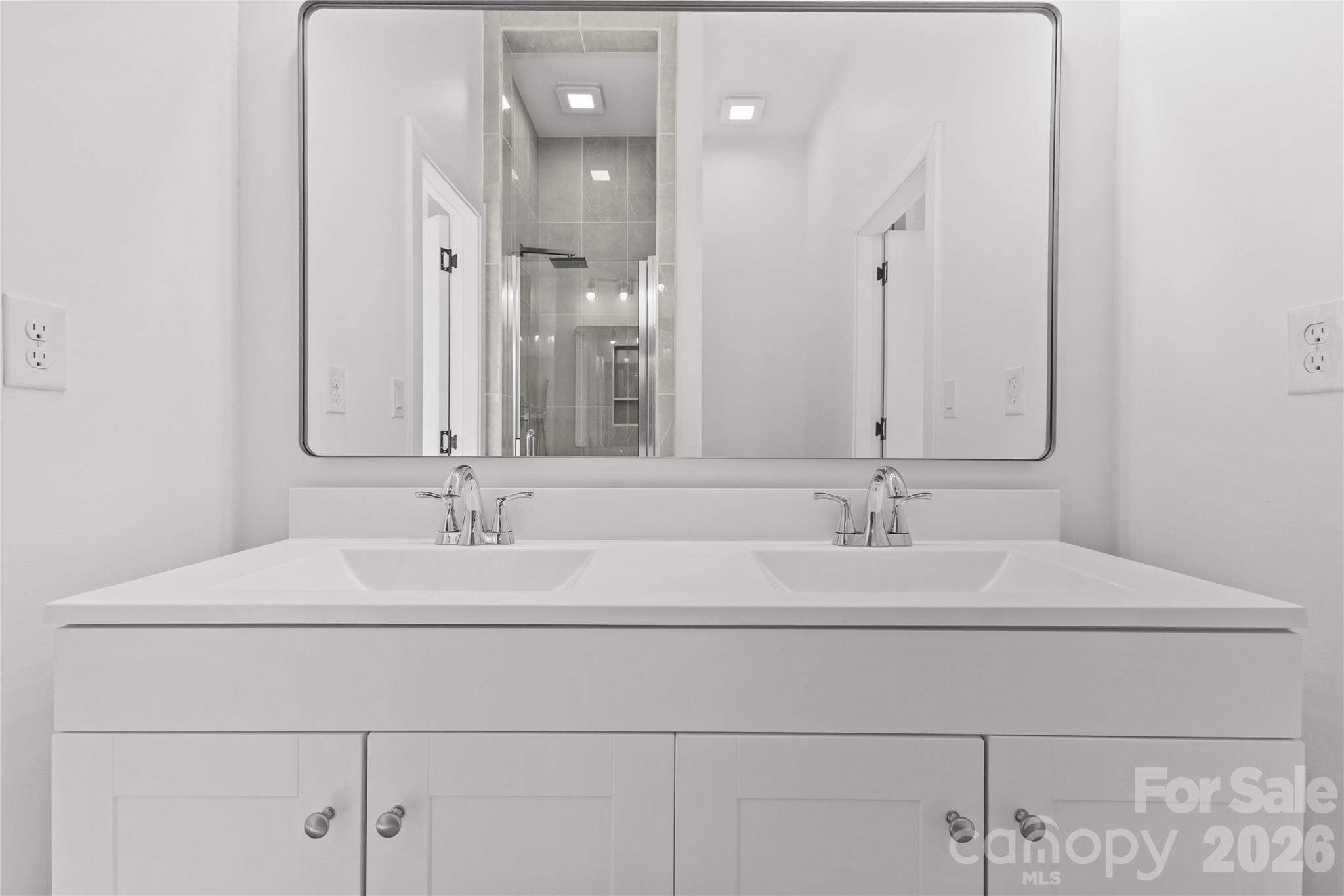 417 Boyte Street Monroe, NC 28110 - Photo 36 of 42 a bathroom with double sink and a mirror