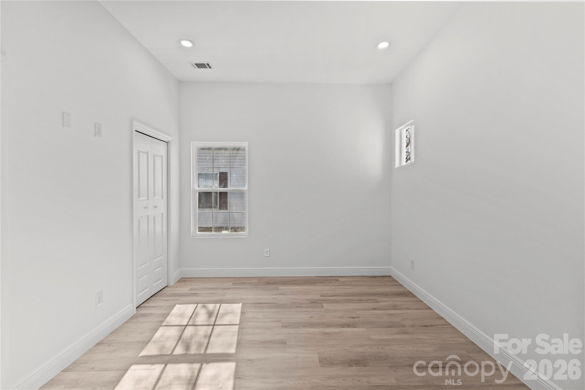 417 Boyte Street Monroe, NC 28110 - Photo 37 of 42 wooden floor in an empty room with a window