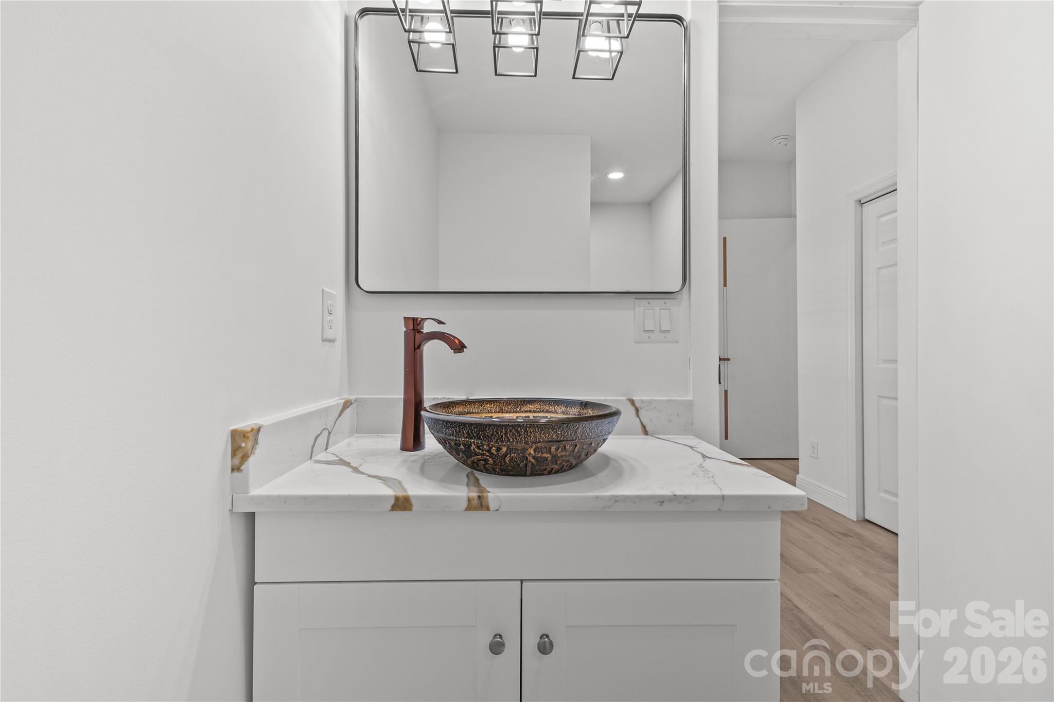 417 Boyte Street Monroe, NC 28110 - Photo 39 of 42 a bathroom with a sink and a mirror