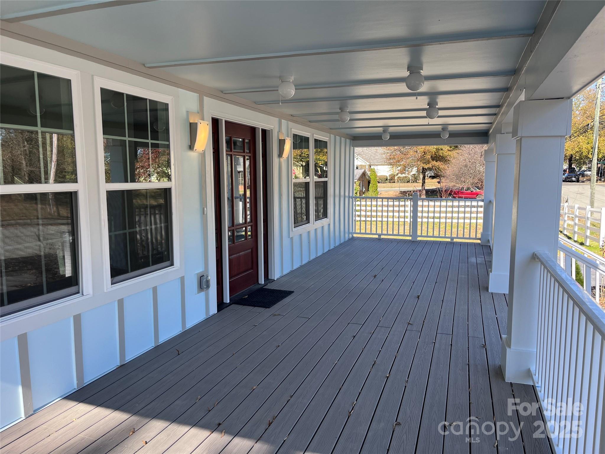417 Boyte Street Monroe, NC 28110 - Photo 5 of 25 a view of an empty room with wooden floor and a window