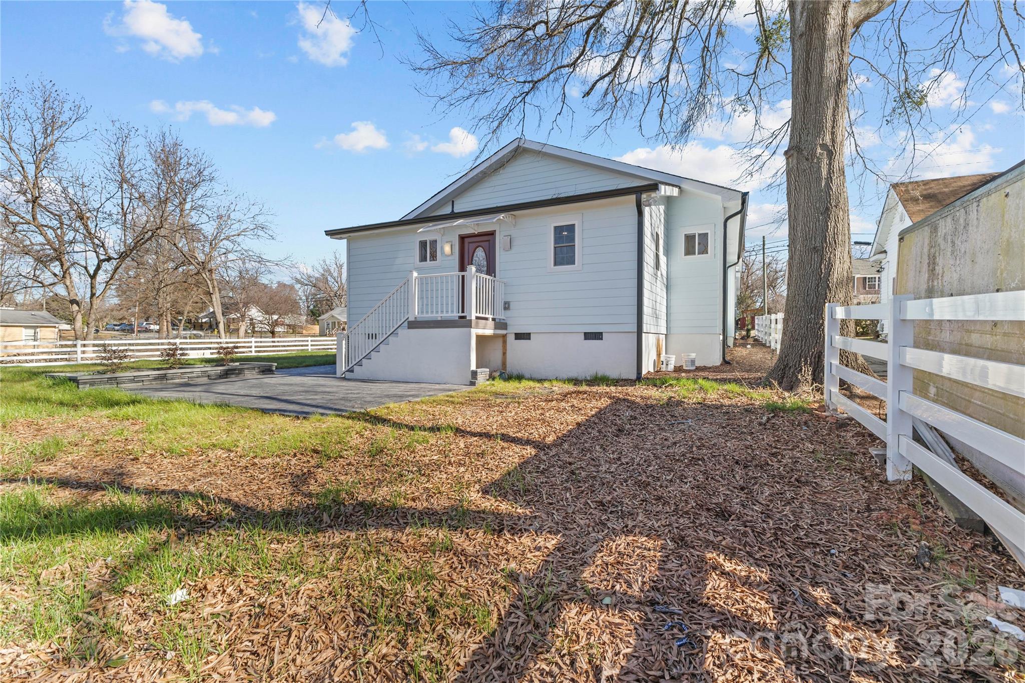 417 Boyte Street Monroe, NC 28110 - Photo 5 of 42 a view of a house with a yard and garage