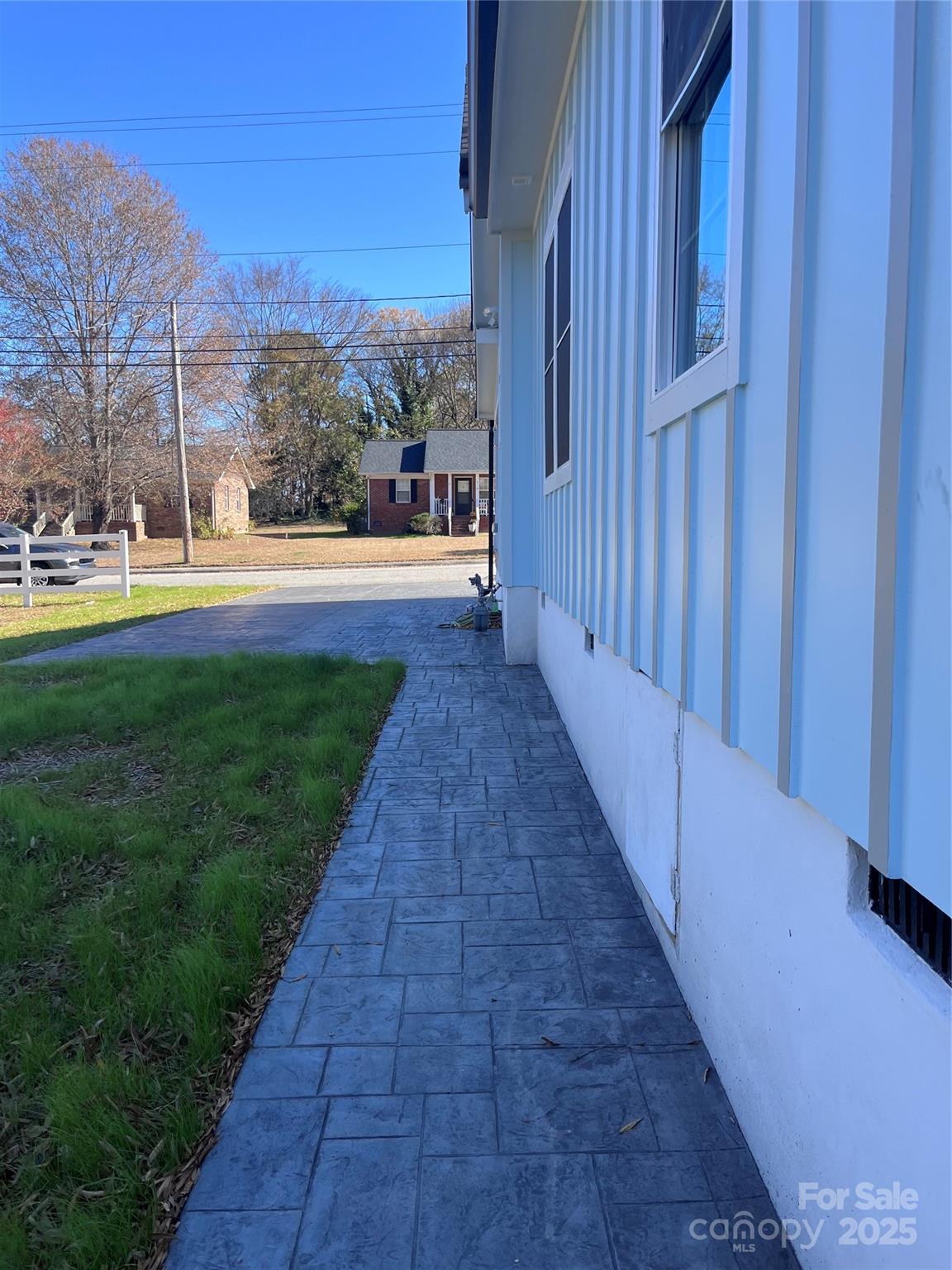 417 Boyte Street Monroe, NC 28110 - Photo 6 of 25 a view of three house with a yard