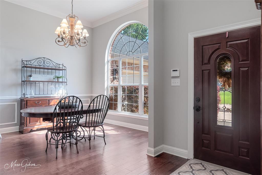 2228 Grapevine Lane Haughton, LA 71037 - Photo 13 of 25 a view of a dining room with furniture wooden floor and chandelier