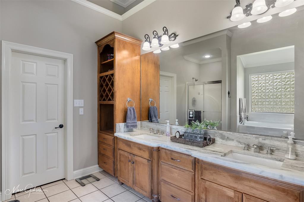 2228 Grapevine Lane Haughton, LA 71037 - Photo 16 of 25 a bathroom with a double vanity sink and a mirror
