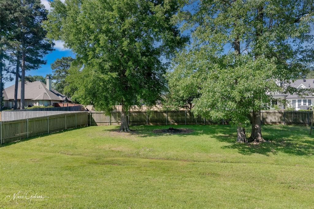 2228 Grapevine Lane Haughton, LA 71037 - Photo 24 of 25 a view of swimming pool with a yard and large trees