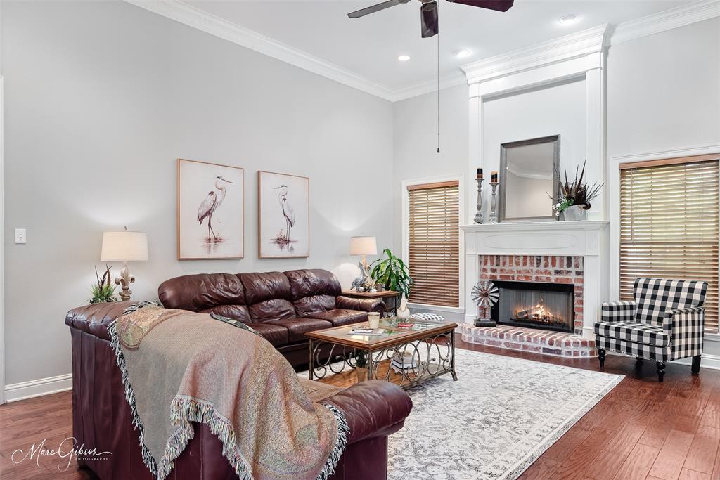 2228 Grapevine Lane Haughton, LA 71037 - Photo 3 of 25 a living room with furniture and a fireplace