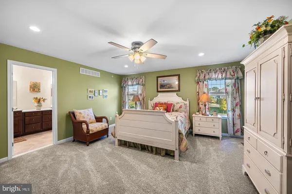 a bed room with furniture and a chandelier