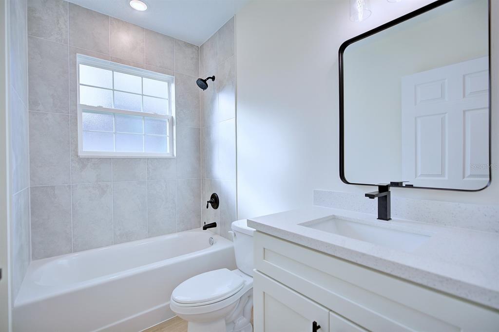 8724 Capilla Street Sebring, FL 33872 - Photo 20 of 33 a bathroom with a sink a toilet and a bathtub