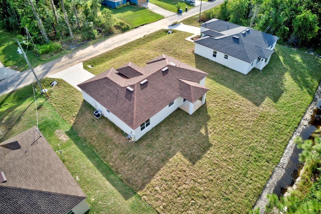 8724 Capilla Street Sebring, FL 33872 - Photo 26 of 33 an aerial view of a house with a garden
