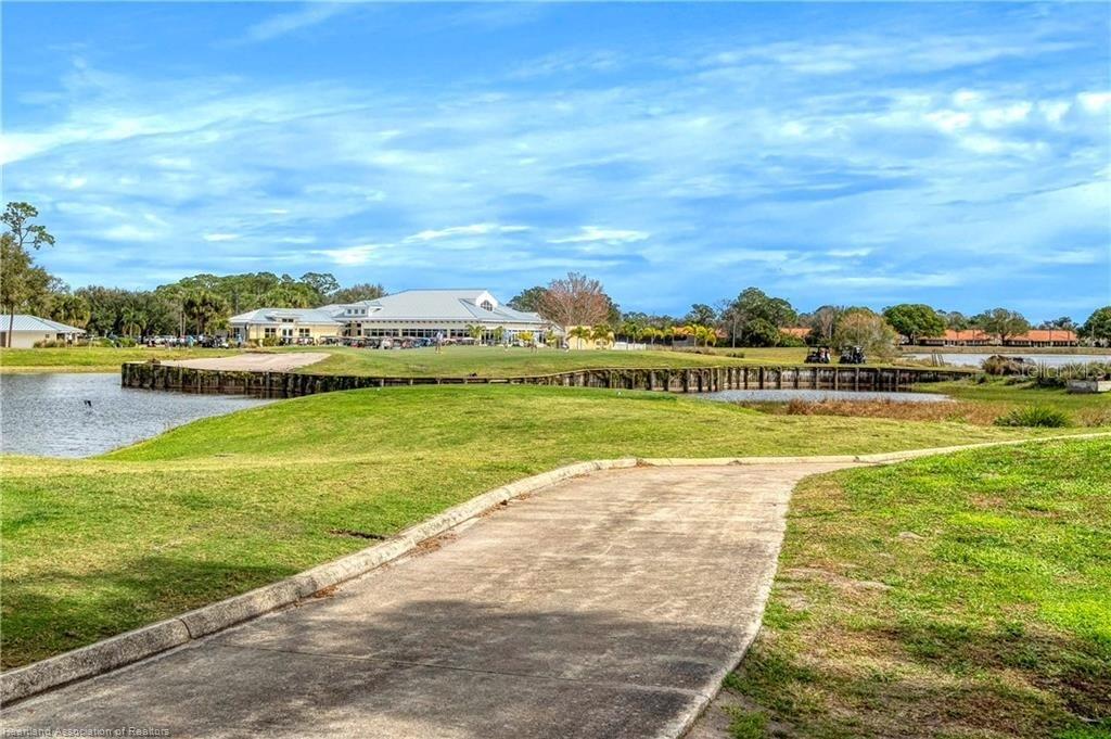 8724 Capilla Street Sebring, FL 33872 - Photo 29 of 33 a view of lake with houses