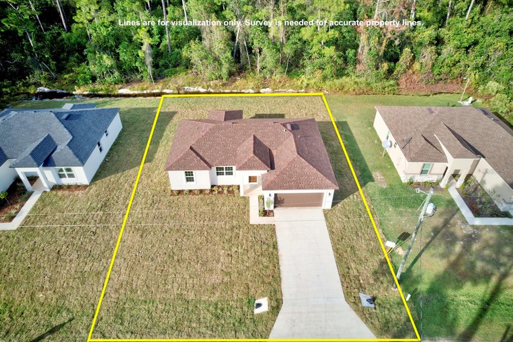 8724 Capilla Street Sebring, FL 33872 - Photo 3 of 33 an aerial view of a house with a big yard