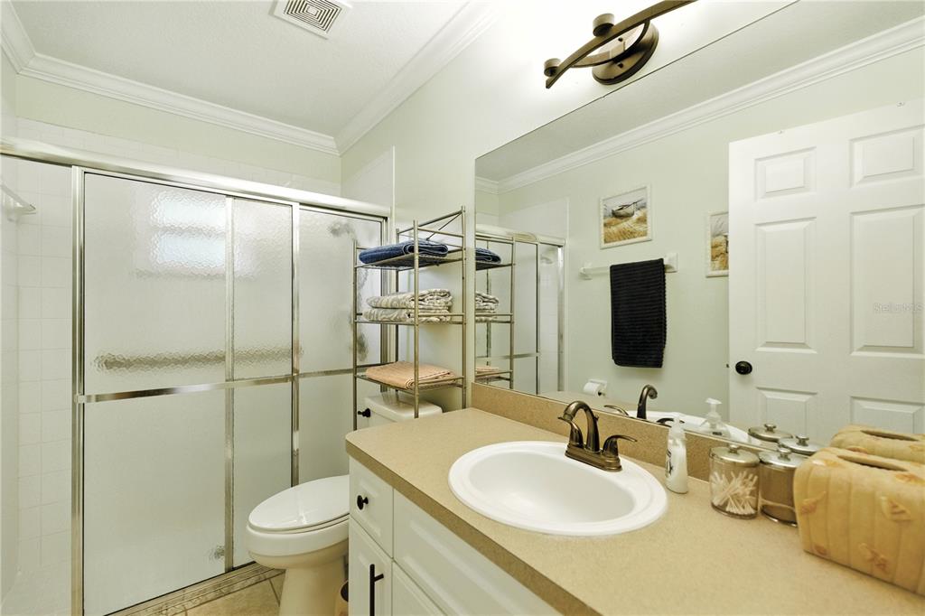 5968 Southwest 103rd Loop Ocala, FL 34476 - Photo 20 of 48 a bathroom with a sink toilet and shower