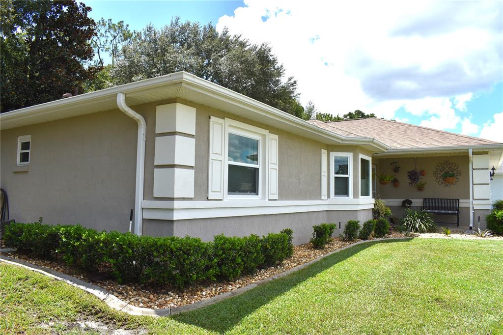 5968 Southwest 103rd Loop Ocala, FL 34476 - Photo 26 of 48 a front view of house with yard and green space