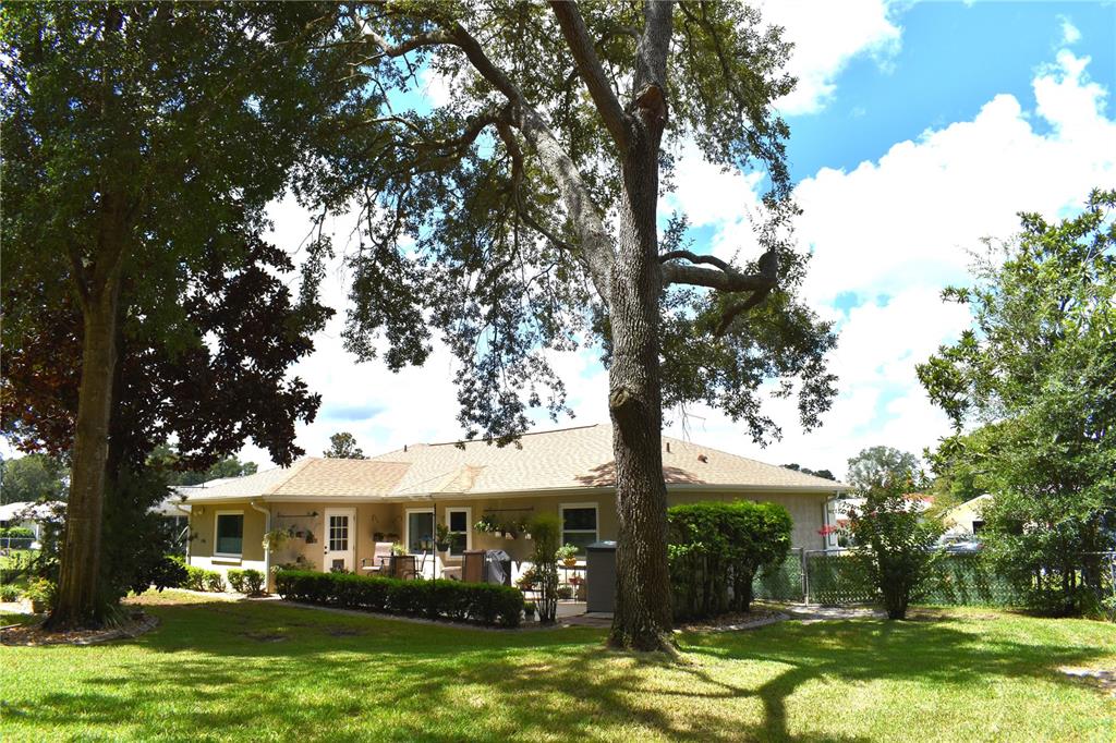 5968 Southwest 103rd Loop Ocala, FL 34476 - Photo 27 of 48 a view of an house with swimming pool and garden