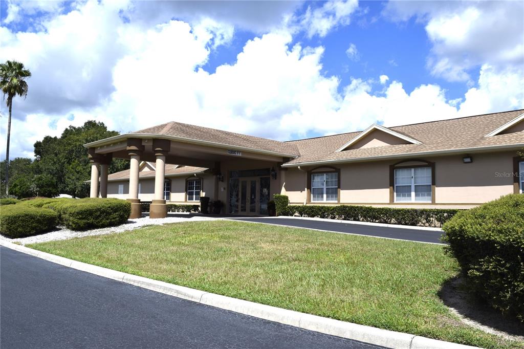 5968 Southwest 103rd Loop Ocala, FL 34476 - Photo 31 of 48 a front view of a house with a yard