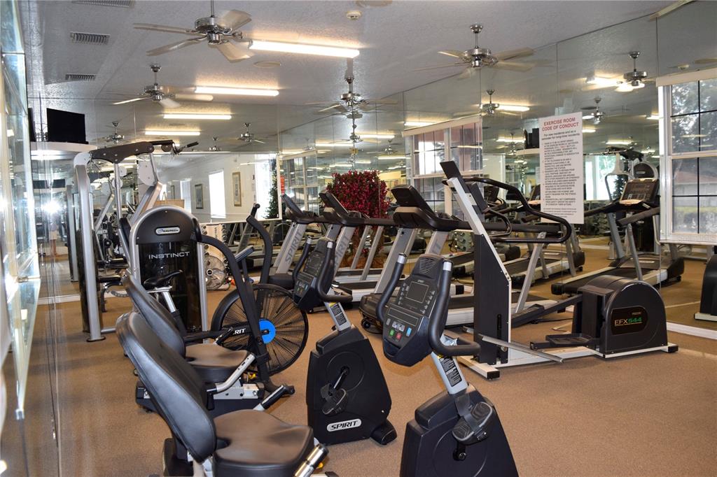 5968 Southwest 103rd Loop Ocala, FL 34476 - Photo 35 of 48 a view of a room with gym equipment